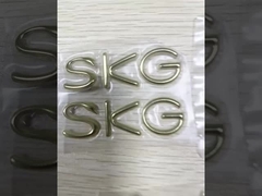 Etiqueta de logotipo en relieve 3D de transferencia de calor TPU de plata dorada personalizada para camiseta