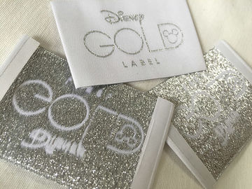Corte frío tejido doblez de las etiquetas de la ropa del extremo de Bage del oro de Disney/corte del calor
