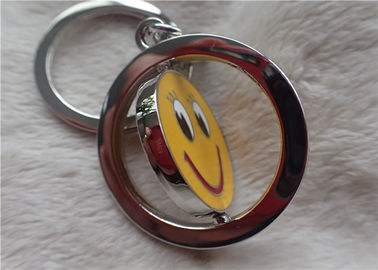 Regalos promocionales personalizados llavero de plata del color con la cara amarilla sonriente rotativa