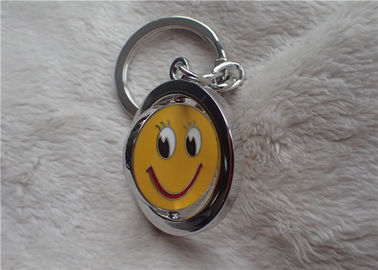 Regalos promocionales personalizados llavero de plata del color con la cara amarilla sonriente rotativa