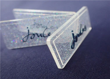 Insignia completamente transparente personalizada del PVC con el polvo colorido para la ropa
