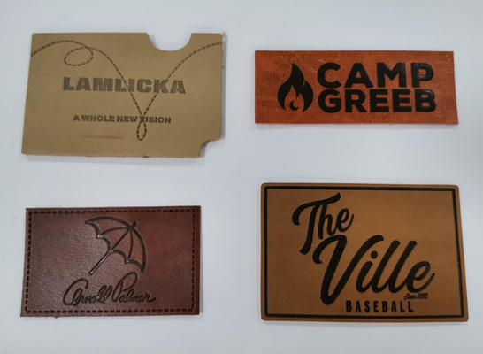 La ropa modificada para requisitos particulares de las parches de cuero de la PU del diseño etiqueta el logotipo grabado en relieve