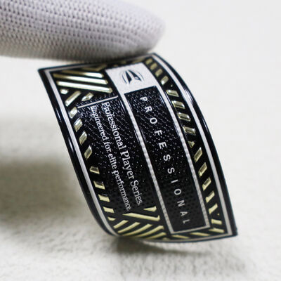 Parche de TPU de alta frecuencia personalizado - Insignia profesional de la serie de jugadores en dorado metálico y negro para ropa deportiva